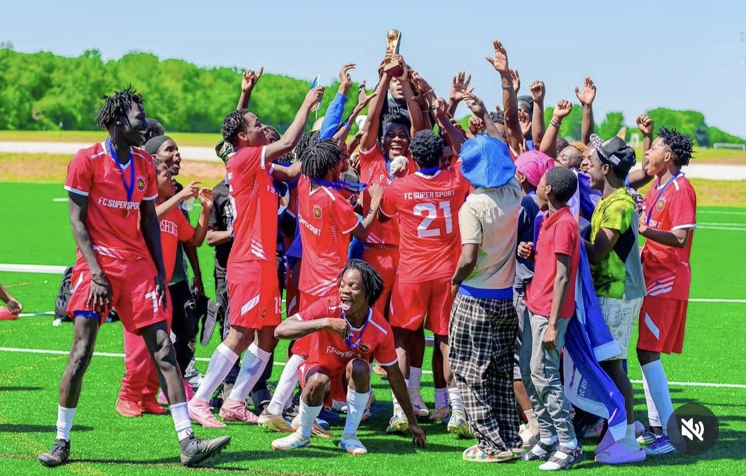 FC Super Sport players lifting the Spring Cup trophy high in celebration