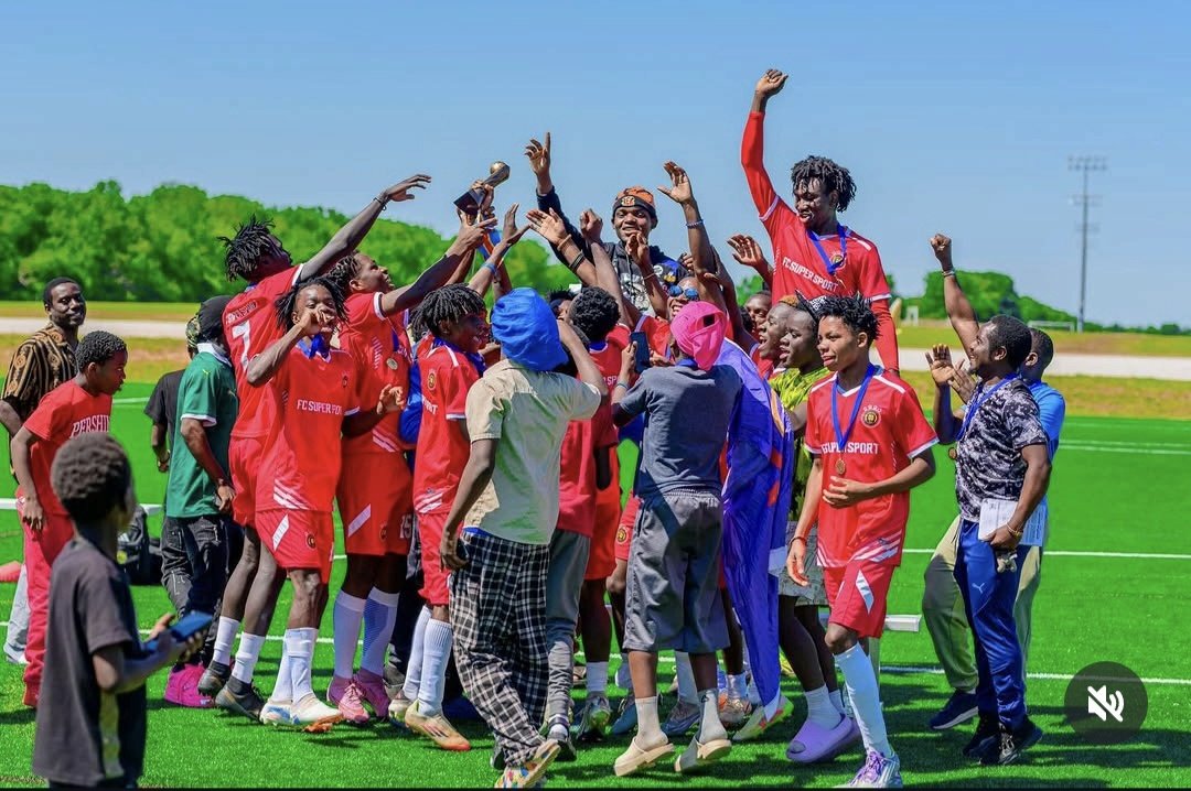 FC Super Sport team celebrating together with the championship trophy