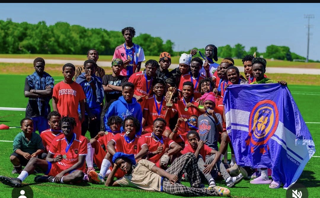 FC Super Sport champions group photo with the team flag